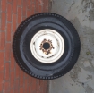 Gebruikte velg met band 26.5x14.00-12NHS Carlisle Ultra trac