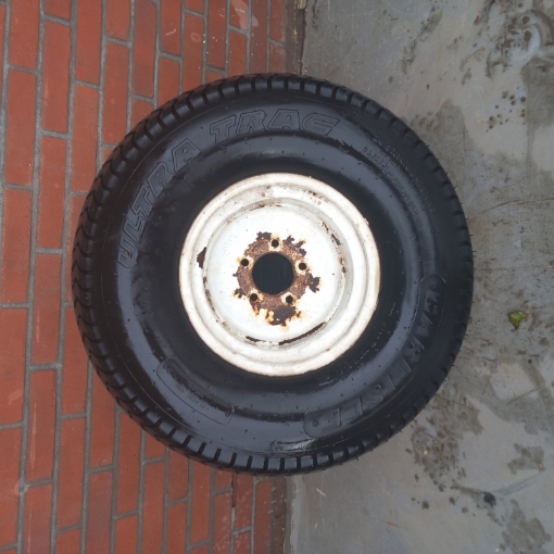 Gebruikte velg met band 26.5x14.00-12NHS Carlisle Ultra trac